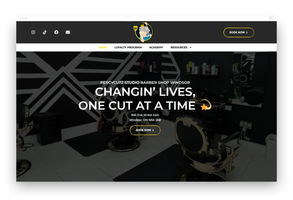 Professional homepage for PercyCutz Studio showing interior barbershop chairs and the "Changin' Lives" slogan.